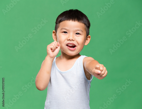Little kid playing kung fu gesture