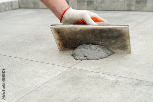 Fotografie Grouting ceramic tiles.