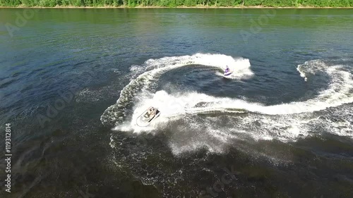 Two guys on jet skis photo