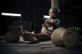 Asian grandmother fisherman with the net bamboo
