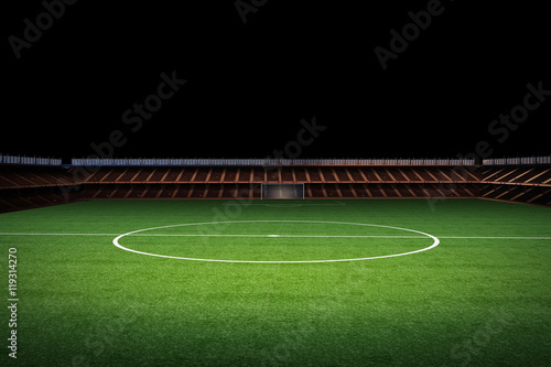 empty stadium with green field