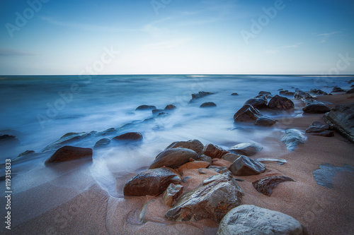 Long exposure of sea and rocks, sunrise shot