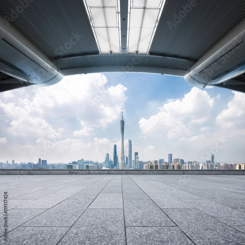 cityscape and skyline of guangzhou from empty brick floor