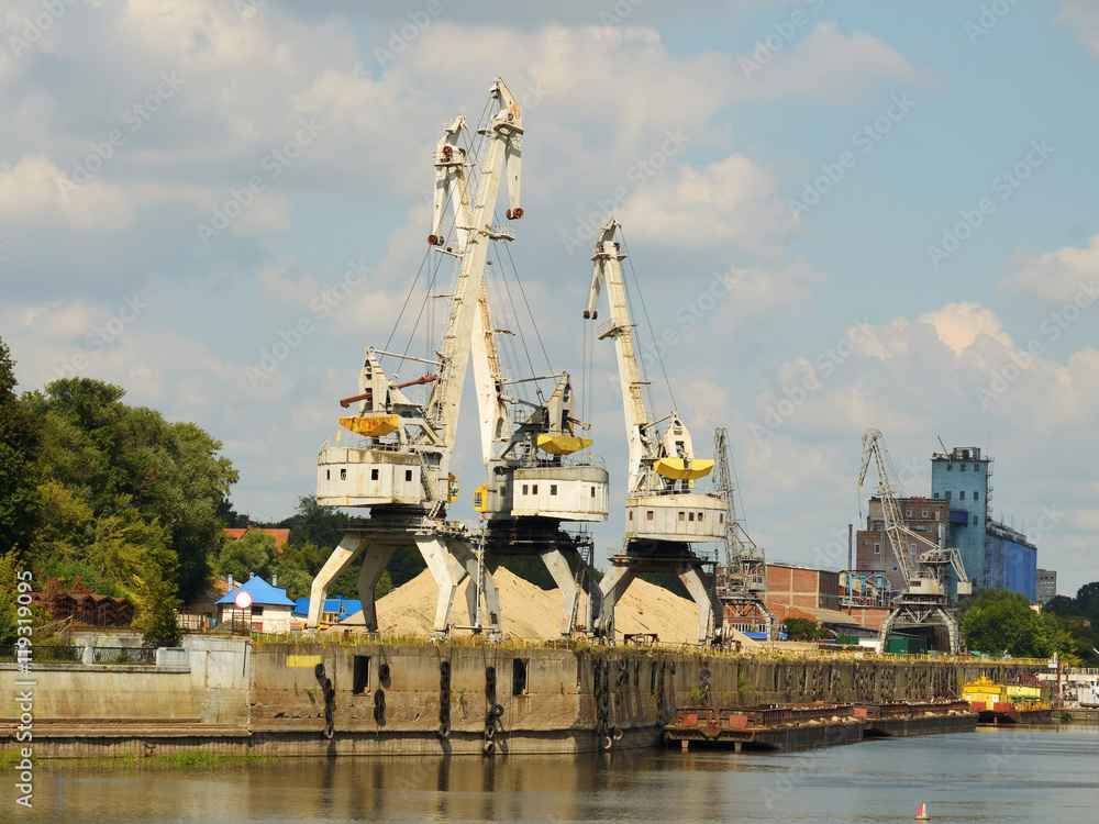 Fototapeta premium A cargo cranes in the port.