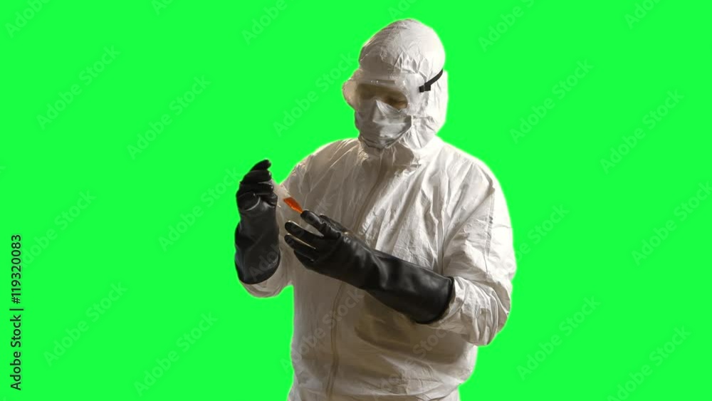 green screen of a doctor in hazmat gear looking at a blood sample green screen of a doctor in hazmat gear looking at a blood sample