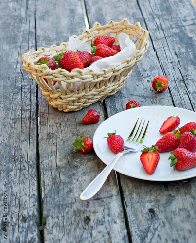 Ripe red strawberries on wooden table