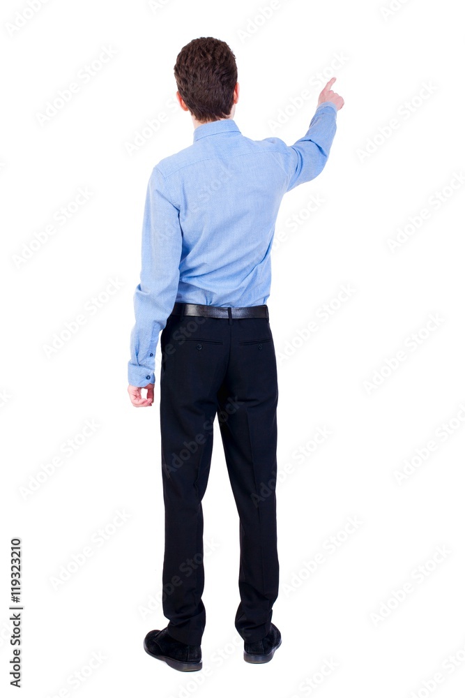 Back view of pointing business man. Businessman in a blue shirt pointing her finger away. Back view of pointing business man. Businessman in a blue shirt pointing her finger away.