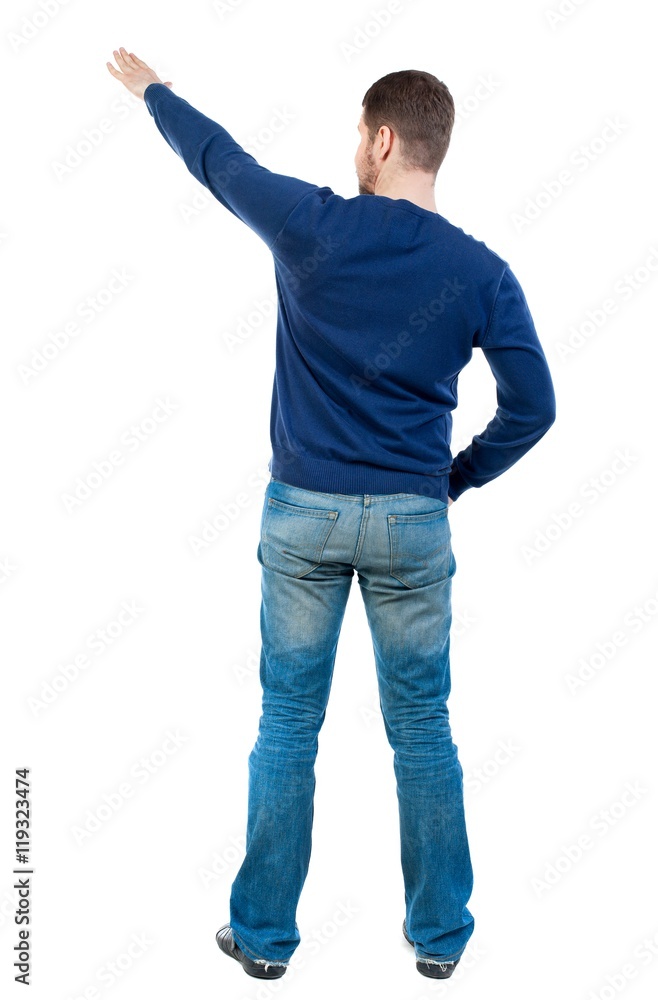 Back view of pointing business man. bearded man in blue pullover shows hand up. Back view of pointing business man. bearded man in blue pullover shows hand up.