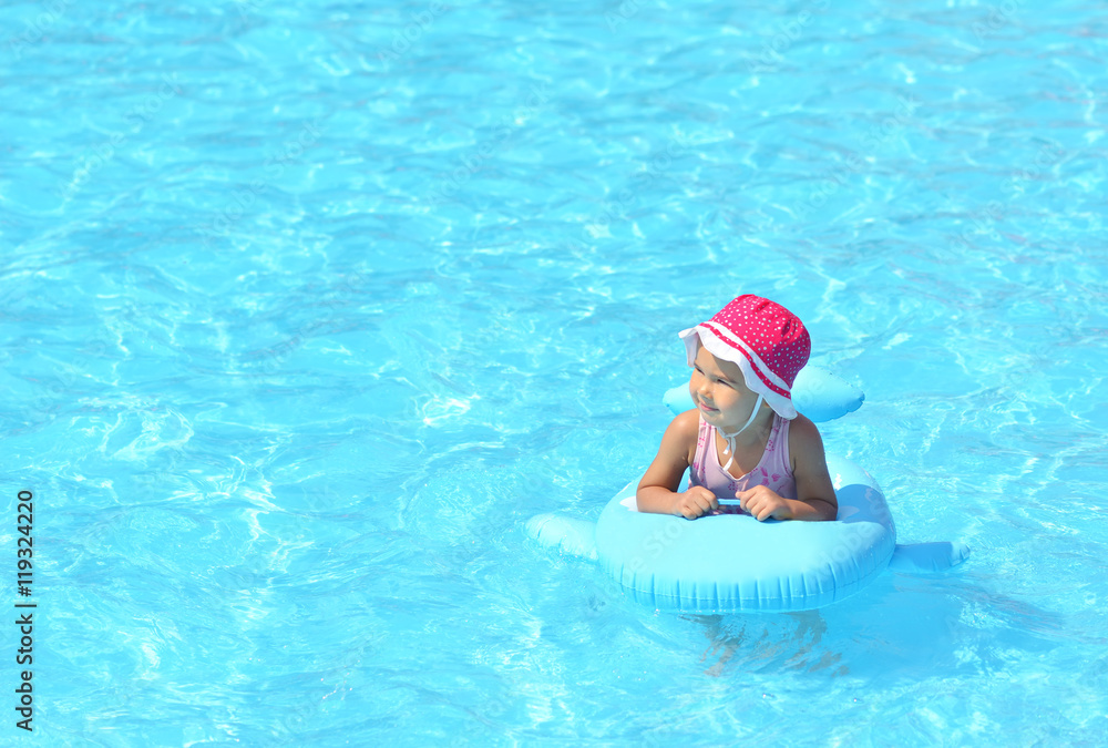 child playing in swimming pool. Summer vacation concept