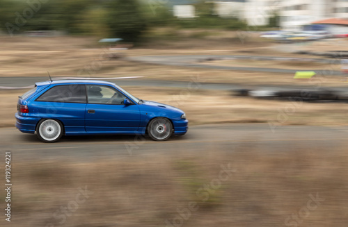 Blue sports car on the track © niki spasov