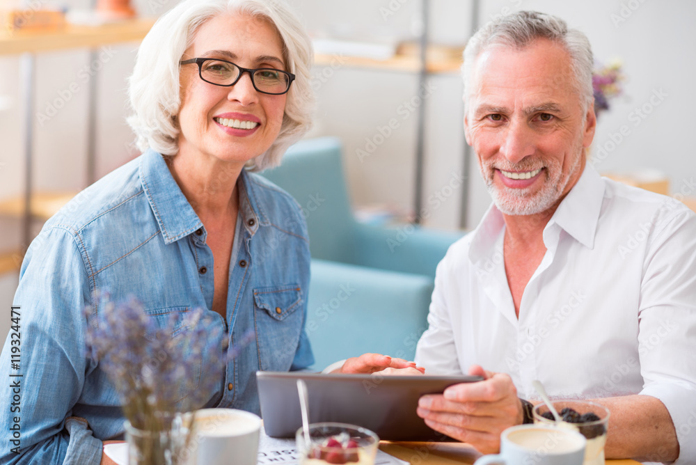 Cheerful smiling couple resting in the cafe Cheerful smiling couple resting in the cafe