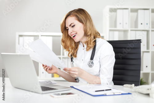 Woman doctor laughing