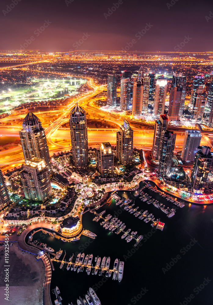 Fototapeta premium Majestic colorful dubai marina skyline during night. Multiple tallest skyscrapers of the world. Dubai marina, United Arab Emirates.