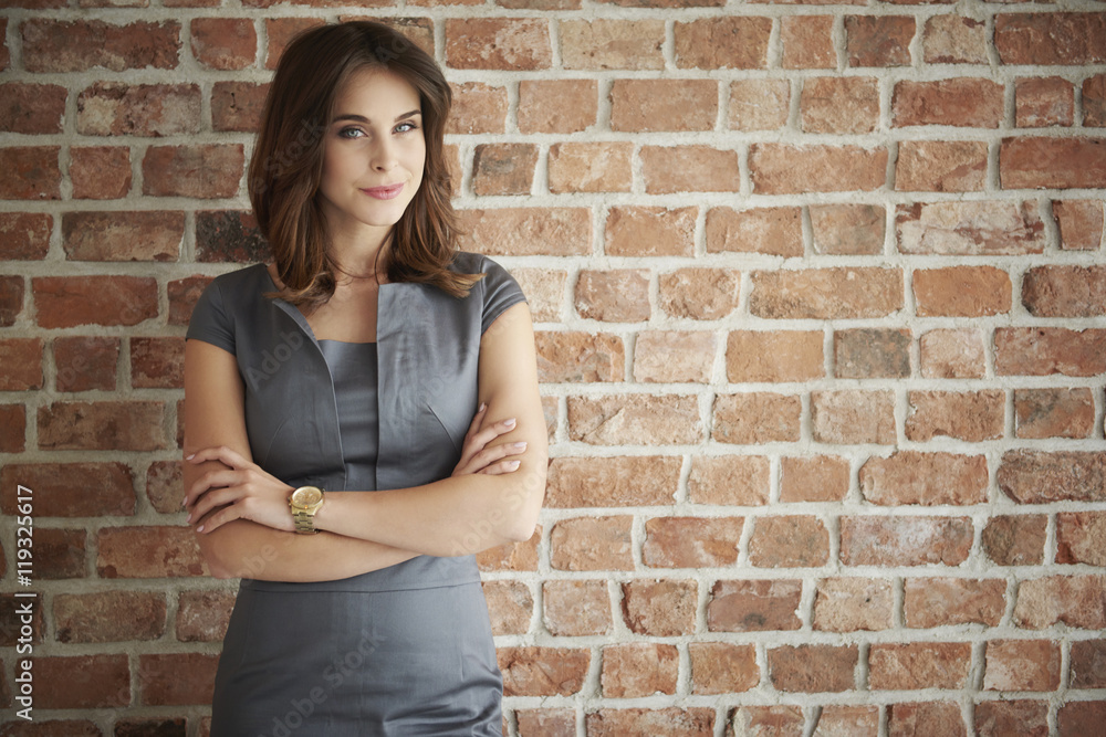 Pensive woman with arms crossed Pensive woman with arms crossed