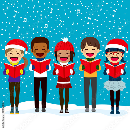 Happy children friends from different ethnicities singing carols at Christmas night