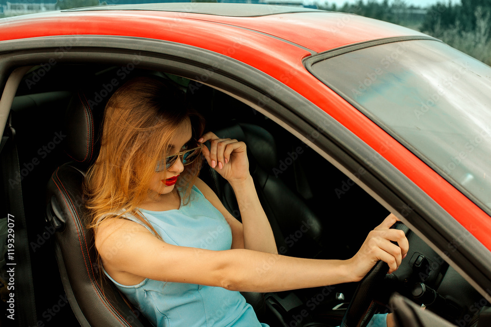 glamour young girl driving sport car