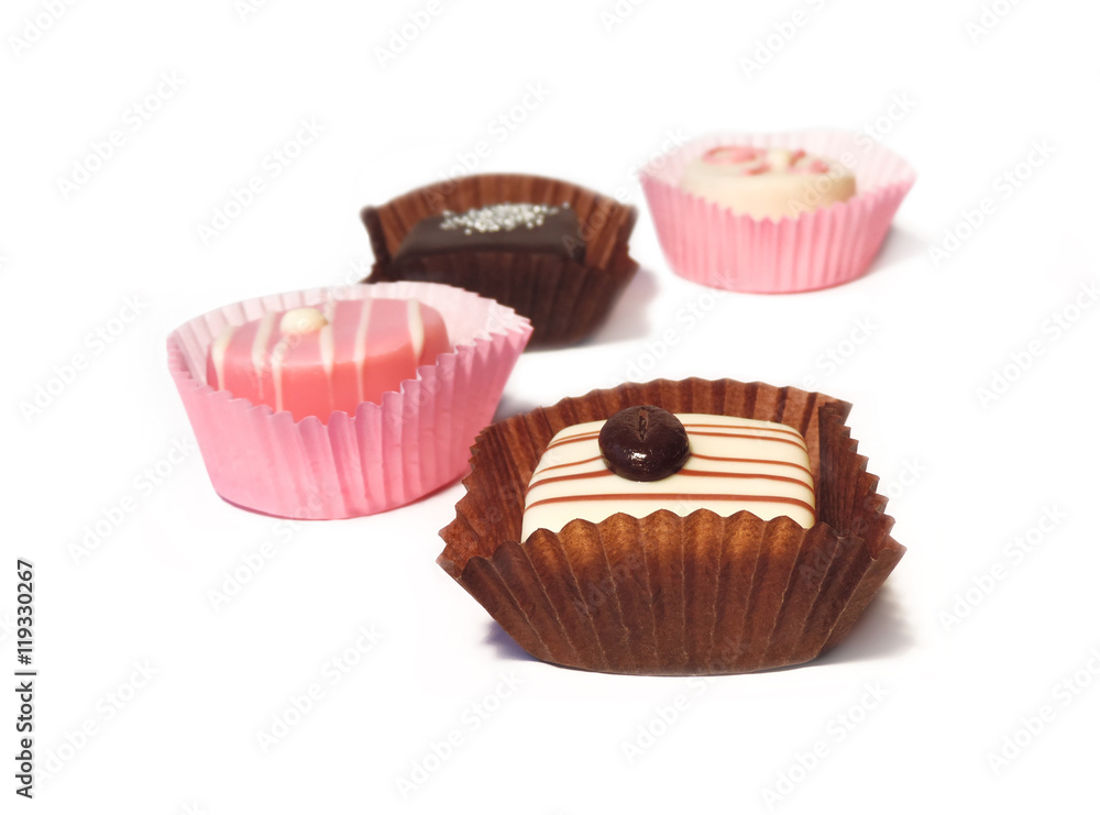 Petit Four chocolates, isolated on white background Petit Four chocolates, isolated on white background