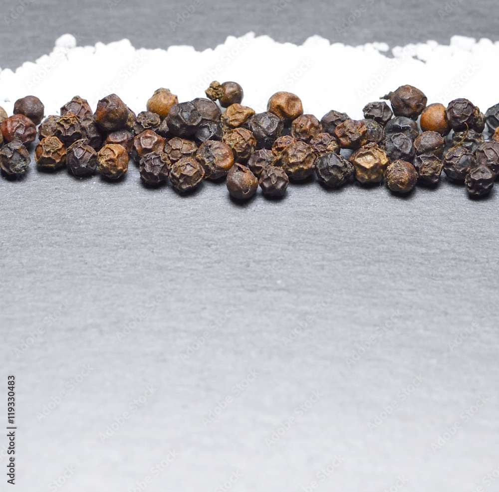 Obraz premium Pepper and salt, isolated on grey background.
