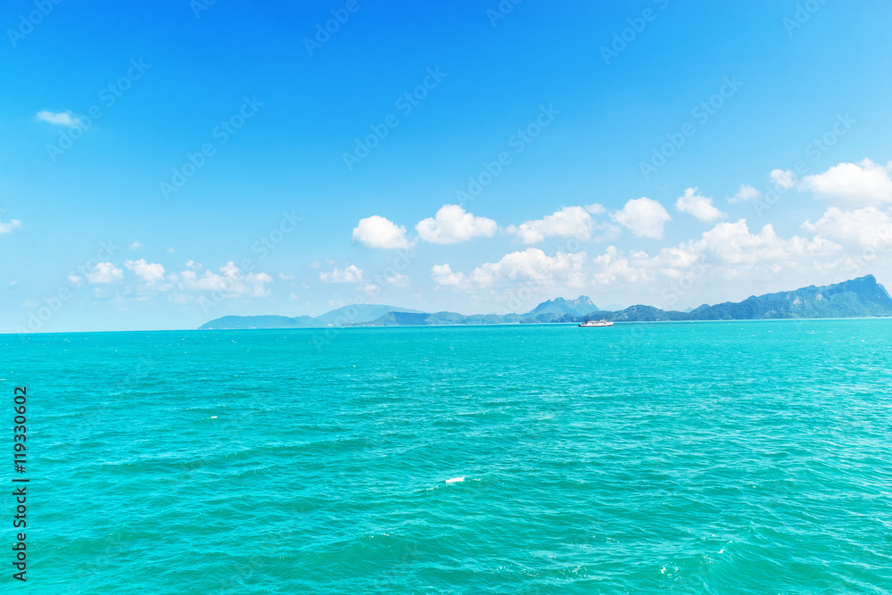Landscape sea blue sky with white clouds floating in the sky.