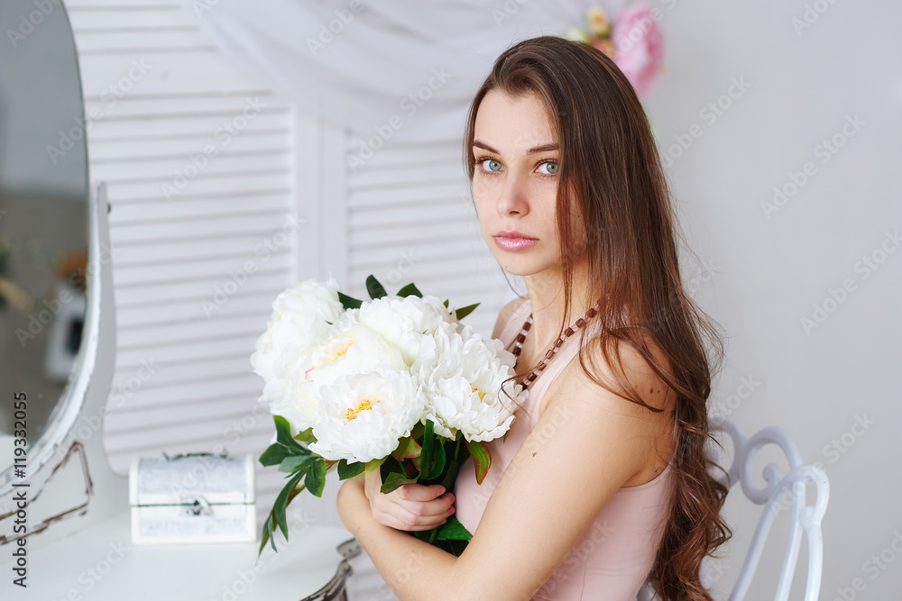 Beautiful girl with a bouquet of white flowers Beautiful girl with a bouquet of white flowers