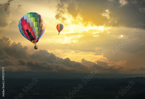Hot air balloon over the hill at sunset © littlestocker