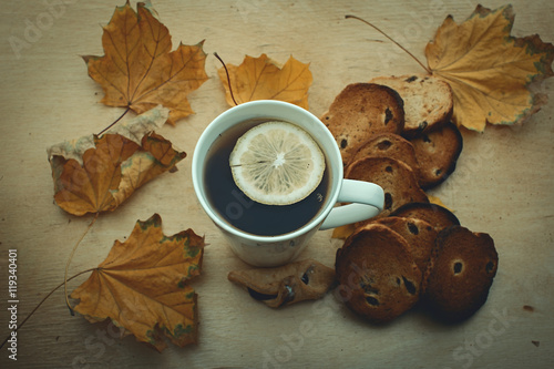 Cup of tea and autumn leaves