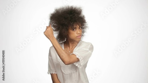 beautiful african american girl doing one's hair