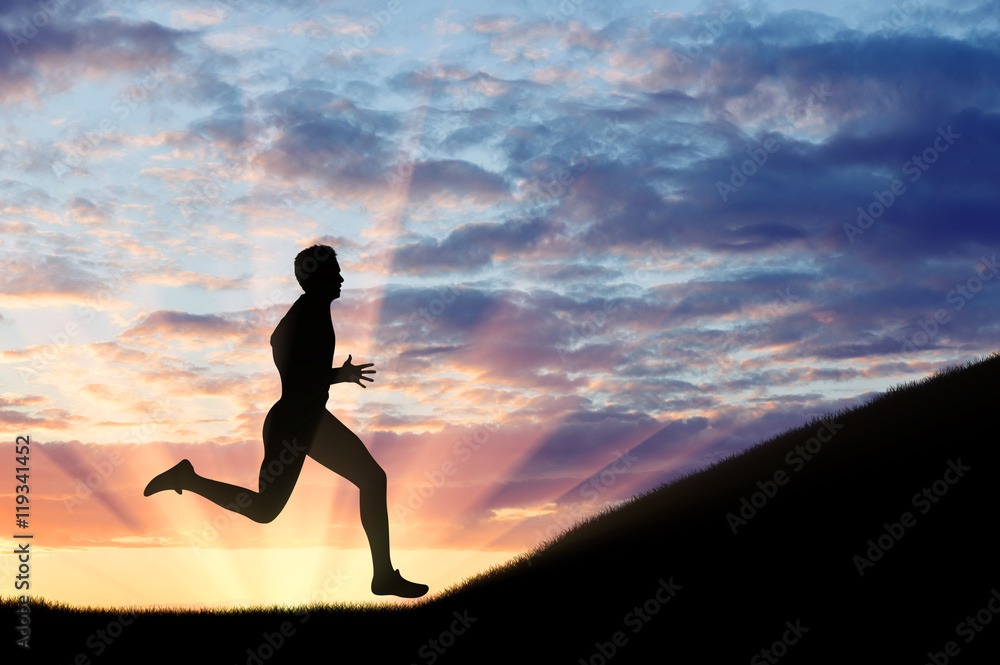 Runner athlete and the hill on his way