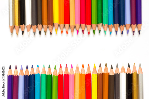 Row of color pencil on white background