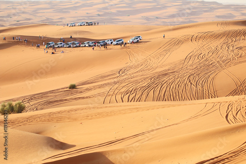 Traveler car and people on a desert safari photo