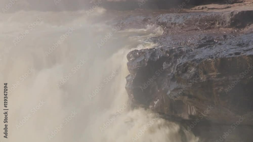 View to the Hukou waterfall at Yellow river (Huang He) in Yichuan, China. Hukou is the largest waterfall at Yellow river and the second largest in China. View to the Hukou waterfall at Yellow river (Huang He) in Yichuan, China. Hukou is the largest waterfall at Yellow river and the second largest in China.