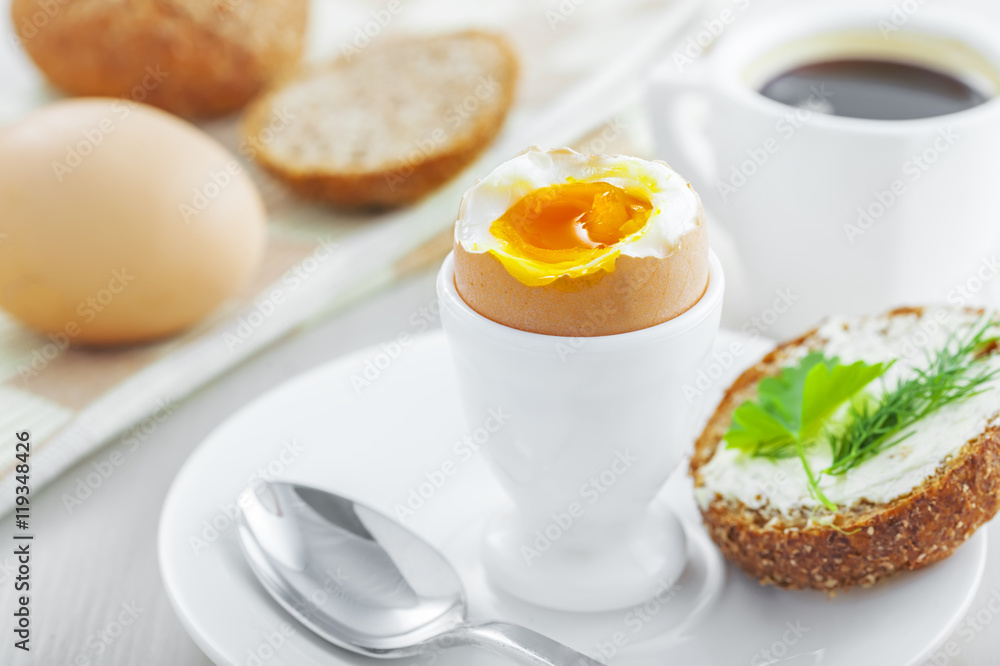 Healthy breakfast with perfect soft boiled egg, bread and butter, coffee cup. Delicious homemade food. Healthy breakfast with perfect soft boiled egg, bread and butter, coffee cup. Delicious homemade food.