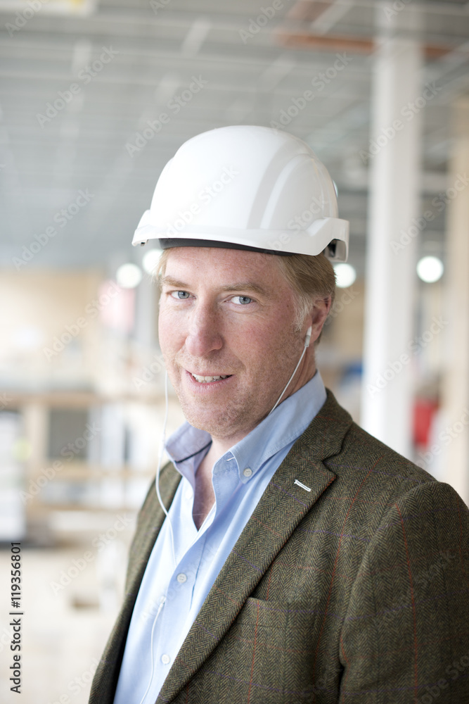 Portrait of smiling architect on building site Portrait of smiling architect on building site