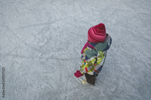 little girl skating in winter