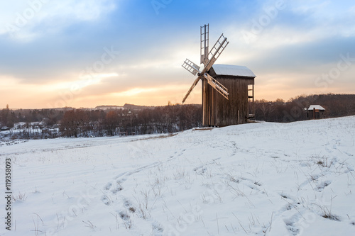 Traditional wooden ukrainian windmill in winter