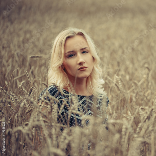 young beautiful girl in autumn field