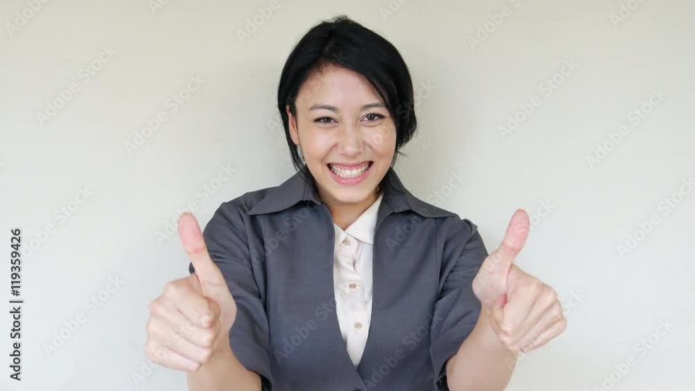 confident, happy business woman giving thumb up gesture confident, happy business woman giving thumb up gesture