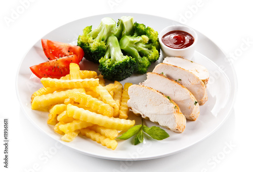 Grilled chicken fillet and vegetables on white background 