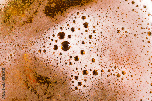 Beer background. Foam with bubbles close up.
