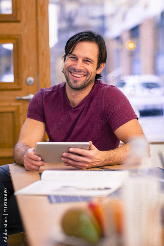 Man in office with digital tablet, Gothenburg, Sweden Man in office with digital tablet, Gothenburg, Sweden