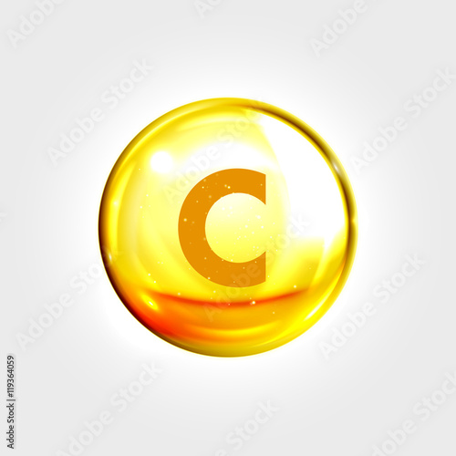 Vitamin C gold icon. Ascorbic acid pill capsule photo