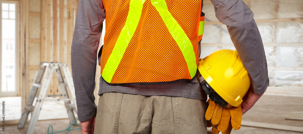Worker with helmet in orange security vest. Worker with helmet in orange security vest.