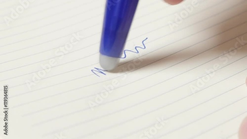 Trying new erasable pen with writing and erasing close-up 4K 2160p 30fps UltraHD footage - Write on paper and erase modern gel pen present 4K 3840X2160 UHD video