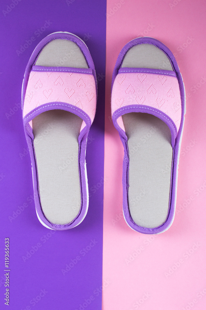 Home slippers for women on a bright background. Flat lay. Home slippers for women on a bright background. Flat lay.