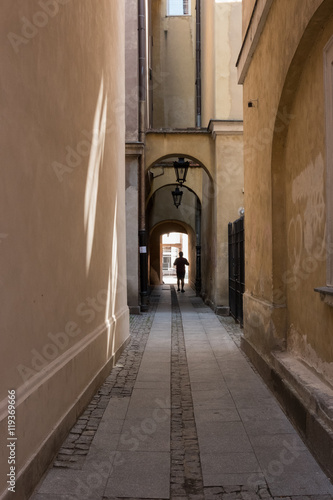 Narrow street in the middle of a big city © tomkaphoto
