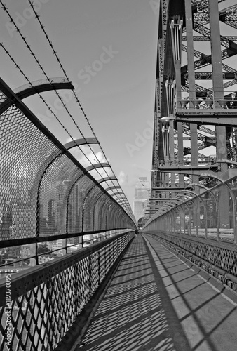 view along the walking path on Sydney harbor bridge in black and white, Australia 