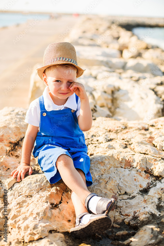 Portrait of a cute blond boy in hat Portrait of a cute blond boy in hat