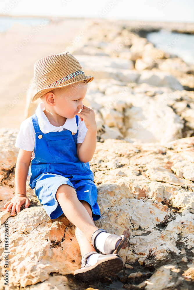 Portrait of a cute blond boy in hat Portrait of a cute blond boy in hat