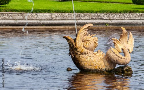 Peterhof Palace St Petersburg, Russia. Golden fish statue fountain in Higher Park. The Peterhof Palace included in the Unesco'S World Heritage list