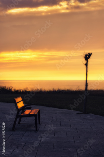bench at sunset near the sea